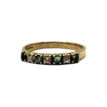 A VINTAGE 18CT GOLD, EMERALD AND DIAMOND HALF ETERNITY RING Four round cut emeralds interspersed