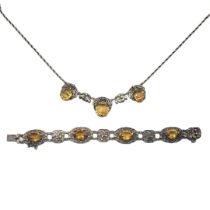 A VINTAGE WHITE METAL AND CITRINE NECKLACE AND BRACELET Faceted stones with pierced white metal