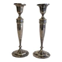 A PAIR OF ART DECO STYLE STERLING SILVER CANDLESTICKS Decagonal shaped bobeche and tapering