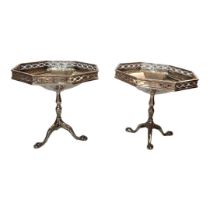 A PAIR OF EARLY 20TH CENTURY SILVER OCTAGONAL SWEETMEAT DISHES With pierced border and tripod