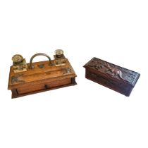 A VICTORIAN STANDISH ON CASED DESK STAND The two cut glass inkwells, metal mounted, with a single