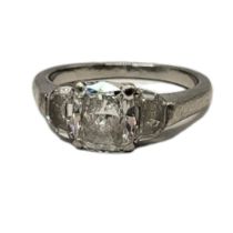 A PLATINUM AND DIAMOND SOLITAIRE RING The single round cut diamond in a plain mount. (approx diamond
