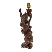 A VINTAGE JAPANESE ROOT CARVING LAMP Figure wearing period attire with toad to foot, signed to base.