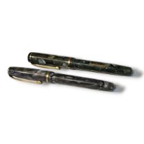 BURNHAM, TWO EARLY 20TH CENTURY FOUNTAIN PENS Green marbled number 50 and a grey marbled case number