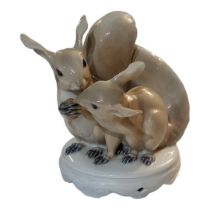 ROYAL COPENHAGEN, A HARD PASTE PORCELAIN GROUP OF SQUIRRELS Painted with a naturalistic light