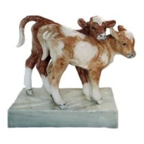 DORIS LINDNER FOR ROYAL WORCESTER, A BONE CHINA FIGURAL GROUP OF YOUNG CALVES Modelled by Lindner