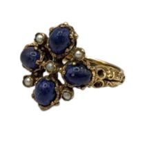 A VINTAGE 9CT GOLD LAPIS LAZULI AND SEED PEARL RING Having an arrangement of cabochon cut stones