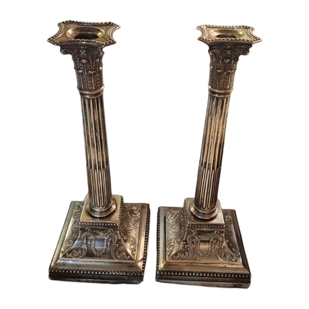 A LARGE PAIR OF LATE 19TH/EARLY 20TH CENTURY SILVER CANDLESTICKS Classical form with reede columns - Image 2 of 2