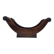 A 19TH CENTURY MAHOGANY CHEESE COASTER Crescent form with applied roundness. (approx 48cm)