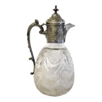 A VICTORIAN SILVER PLATE AND CUT LEAD CRYSTAL CLARET JUG Having a single carry handle embossed