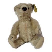 STEIFF, A VINTAGE MOHAIR TEDDY BEAR Light coloured fur with button and tag to left ear. (approx