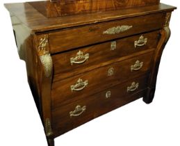 A 19TH CENTURY CONTINENTAL WALNUT COMMODE CHEST OF FOUR LONG DRAWERS Flanked by columns, with