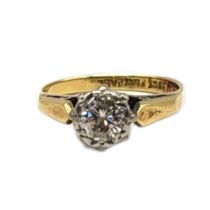 AN EARLY 20TH CENTURY 18CT GOLD AND DIAMOND SOLITAIRE RING The single round cut diamond in a