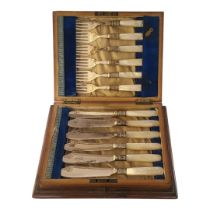 A SET OF EDWARDIAN SILVER PLATE AND MOTHER OF PEARL FISH KNIVES AND FORKS Having engraved decoration