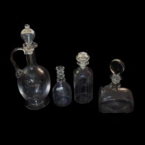 A HIGH VICTORIAN CLEAR GLASS FLAGON AND MATCHING STOPPER With loop handle on conical foot, an