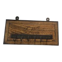 AN EARLY 19TH CENTURY OAK AND IRON COAT RACK Rectangular form, with engraved initials ‘J.W.’,