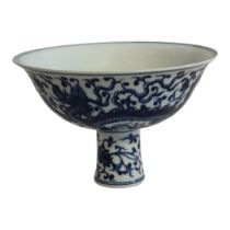 A CHINESE BLUE AND WHITE PORCELAIN 'DRAGON' STEM CUP Decorated with five claw dragons and six