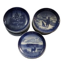 ROYAL COPENHAGEN, A LARGE COLLECTION OF COMMEMORATIVE BLUE AND WHITE CHRISTMAS PLATES Including