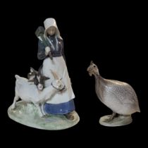 CHRISTIAN THOMPSON FOR ROYAL COPENHAGEN, A HARD PASTE PORCELAIN FIGURAL GROUP Shepherdess and two