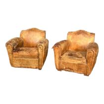 A PAIR FRENCH ART DECO CLUB ARMCHAIRS In distressed tan leather upholstery. (w 69cm x d 70cm x h