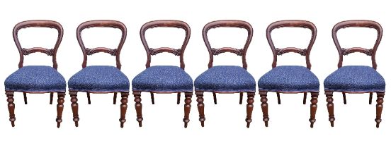 A SET OF SIX VICTORIAN STYLE MAHOGANY DINING CHAIRS Carved back rail overstuffed blue upholstery, on