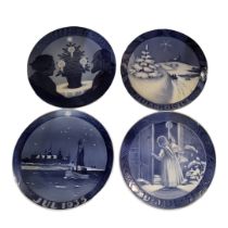 ROYAL COPENHAGEN, A COLLECTION OF FOUR EARLY BLUE AND WHITE CHRISTMAS PLATES Consisting of 1912,