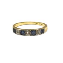 A VINTAGE 18CT GOLD, SAPPHIRE AND DIAMOND HALF ETERNITY RING Having a row of square cut sapphires