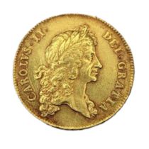 A KING CHARLES II, 1668 - 1678, A 22CT GOLD FIVE GUINEA COIN, DATED 1676 With portrait with laureate