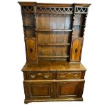 AN 18TH CENTURY AND LATER OAK DRESSER With pierced fretwork apron above open shelves and marquetry