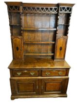 AN 18TH CENTURY AND LATER OAK DRESSER With pierced fretwork apron above open shelves and marquetry