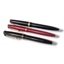 PARKER, TWO VINTAGE FOUNTAIN PENS Having gold plated mounts two black cases and one burgundy, each