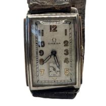 OMEGA, AN EARLY 20TH CENTURY STAINLESS STEEL AND 9CT GOLD TANK GENT’S WRISTWATCH Rectangular form