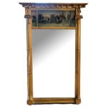 A 19TH CENTURY GILT FRAMED TRUMEAU MIRROR The reverse glass painted riverside landscape flanked by