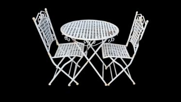 A LATTICEWORK IRON FOLDING GARDEN TABLE AND TWO CHAIRS. Condition: some light rust