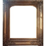 A LARGE 19TH CENTURY GILT GESSO PICTURE/MIRROR FRAME, With floral corners, internal arched slip. (