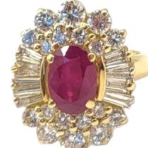 A VINTAGE 18CT GOLD, RUBY AND DIAMOND CLUSTER RING The central oval cut ruby in an arrangement of