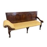 AN 18TH CENTURY DESIGN OAK SETTLE With panelled back above open arm and scroll end, upholstered in a