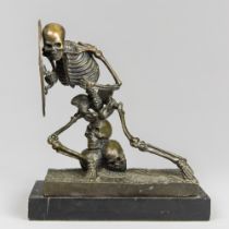 A LATE 20TH CENTURY BRONZE MEMENTO MORI BOOKEND. Modelled as a shielded skeleton figure supported by