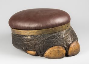 A LATE 19TH/EARLY 20TH CENTURY TAXIDERMY ELEPHANT FOOT FOOTSTOOL (LOXODONTA). With later