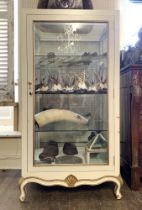 A LARGE LOUIS XV STYLE RETAIL OR CURIO DISPLAY CABINET. Painted white with gilt detail, three glazed