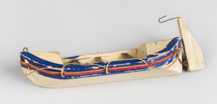 A 19TH CENTURY GERMAN WOODEN TOY BOAT MODEL. With rudder (h 7cm x w 18cm x d 5cm)