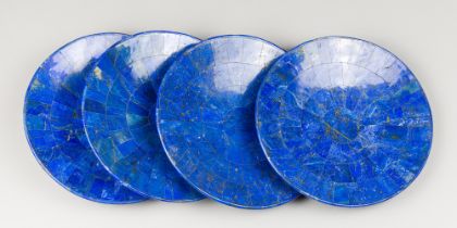 A SET OF FOUR LAPIS LAZULI PLATES (25.5cm x 25.5cm).