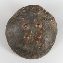 A 19TH CENTURY INDIAN DHAL HIDE SHIELD.