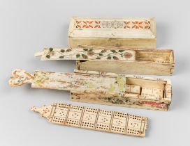 A COLLECTION OF 19TH CENTURY PRISONER OF WAR BONE DOMINOES SETS AND A CRIBBAGE BOARD. Largest (w