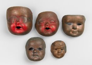 A SET OF EARLY 20TH CENTURY COPPER HEAD PORCELAIN DOLL MOULDS. All stamped. Largest (h 11cm x w 10cm