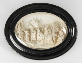 A LATE 19TH CENTURY OVAL PLASTER RELIEF PLAQUE. High relief and crisp detail with a scene of knights
