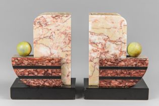 AN UNUSUAL PAIR OF EARLY 20TH CENTURY ART DECO MARBLE BOOKENDS.