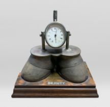 ‘BEAUTY’, AN UNUSUAL LATE 19TH CENTURY SILVER MOUNTED HORSE HOOF CLOCK. With hinged lid to velvet