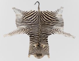 A LATE 20TH CENTURY TAXIDERMY BURCHELL'S ZEBRA SKIN RUG (EQUUS QUAGGA BURCHELLII).