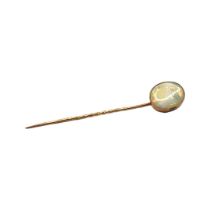 A LATE VICTORIAN/ EARLY EDWARDIAN YELLOW METAL AND OPAL STICK PIN, YELLOW METAL TESTED AS 9CT GOLD